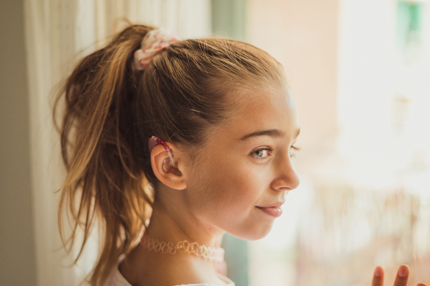 Young Girl With Hearing Aids Remove Stigma With Auditdata