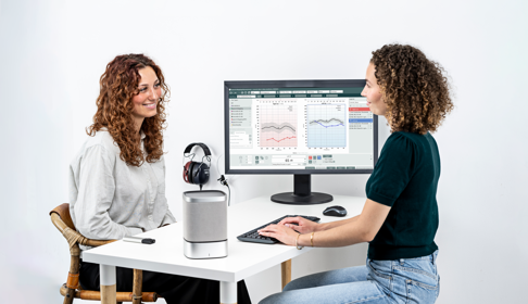Speech Mapping Audiologist With Patient